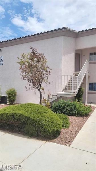 view of side of property featuring stucco siding