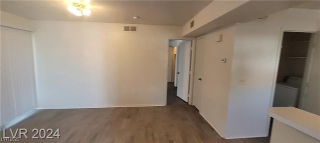 empty room featuring visible vents and wood finished floors