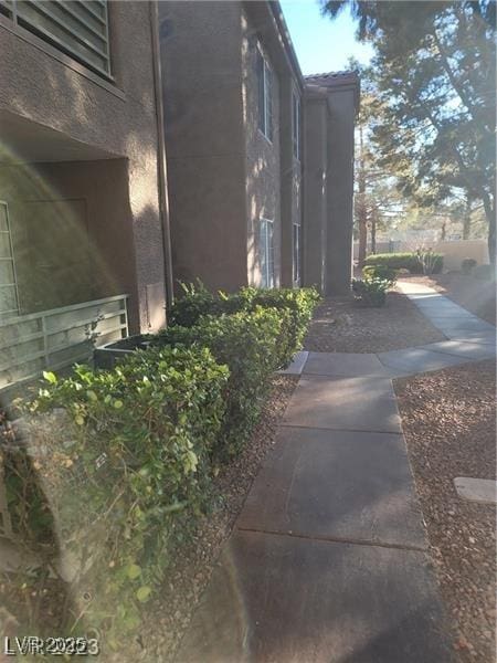 view of side of home featuring stucco siding