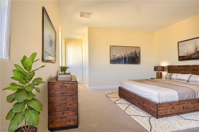 bedroom featuring carpet, visible vents, and baseboards