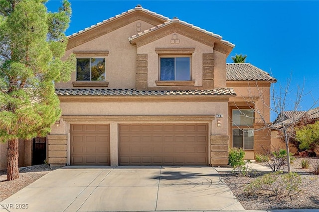 view of front of property featuring a garage, concrete driveway, a tiled roof, and stucco siding