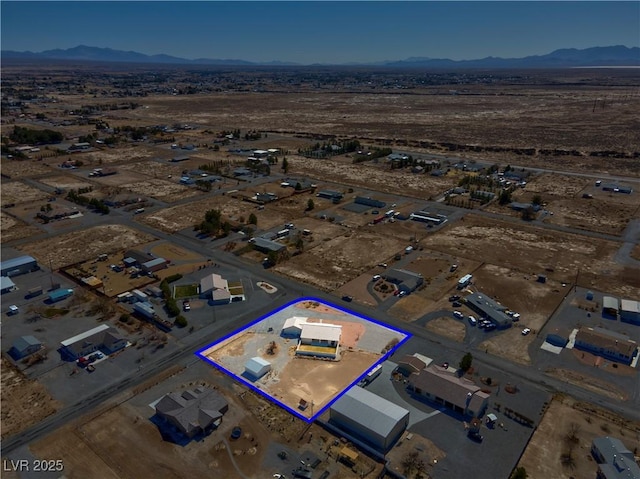 bird's eye view with a mountain view and a desert view