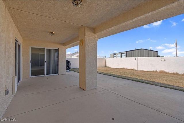 view of patio with fence