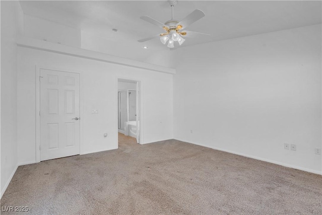 carpeted empty room featuring a ceiling fan