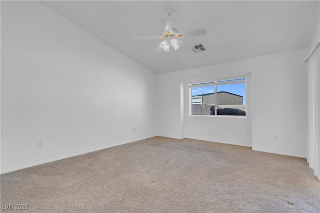 unfurnished room featuring a ceiling fan, lofted ceiling, visible vents, and carpet flooring