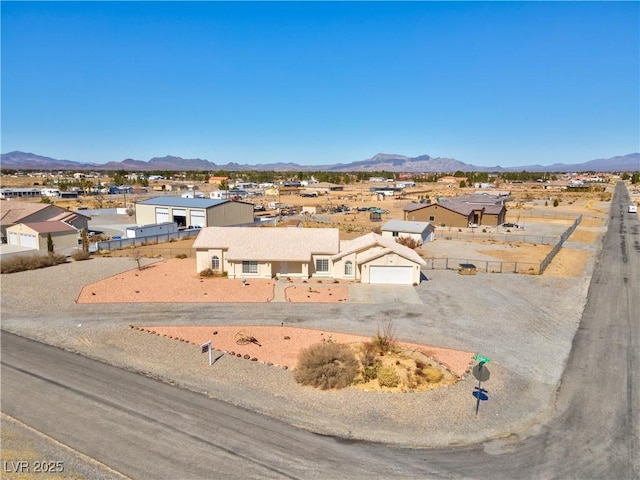 birds eye view of property featuring a residential view and a mountain view