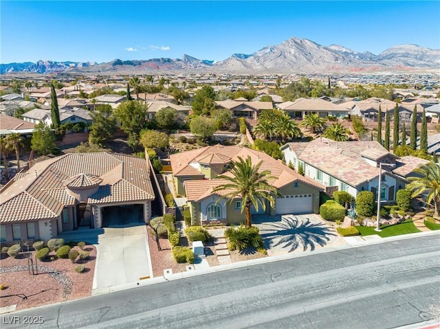 birds eye view of property with a mountain view and a residential view