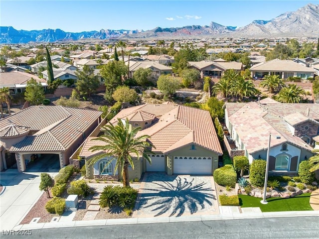 birds eye view of property with a residential view and a mountain view