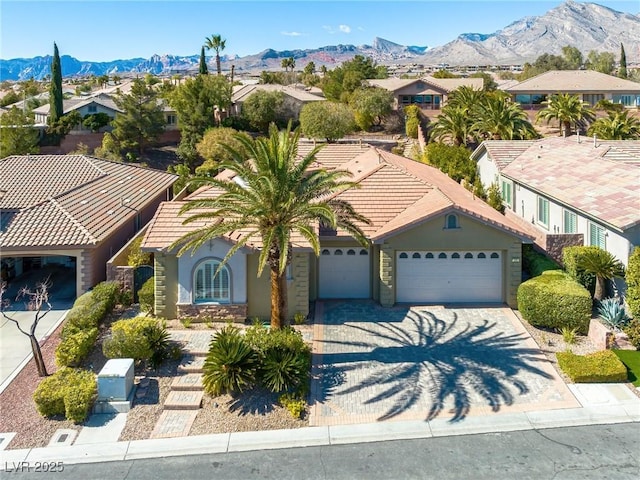 drone / aerial view with a residential view and a mountain view