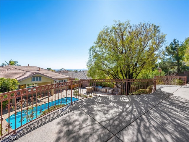 view of patio / terrace with a fenced in pool and fence