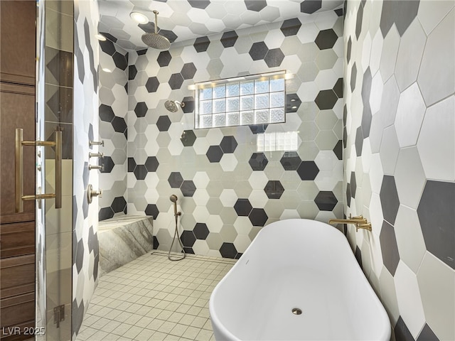 bathroom featuring tiled shower and tile patterned flooring