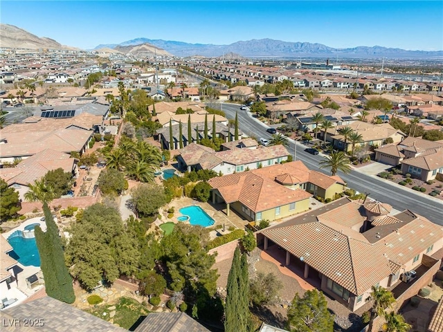 drone / aerial view featuring a mountain view and a residential view