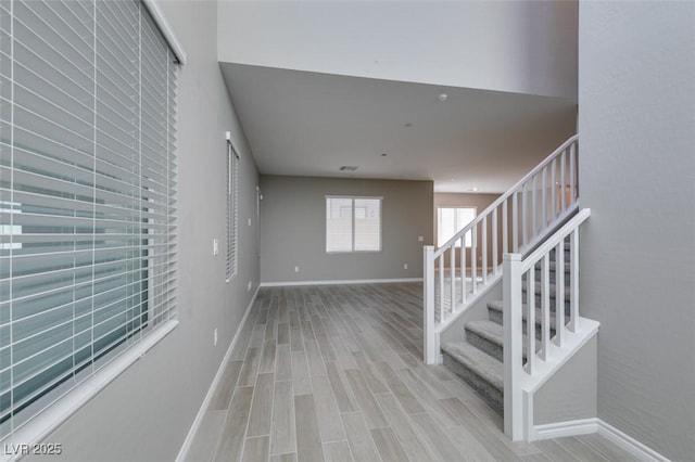 interior space featuring wood finished floors and baseboards