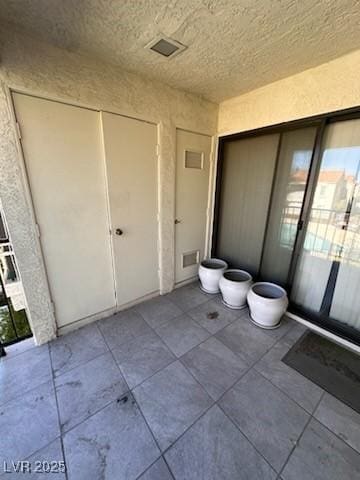 bathroom with tile patterned flooring and visible vents