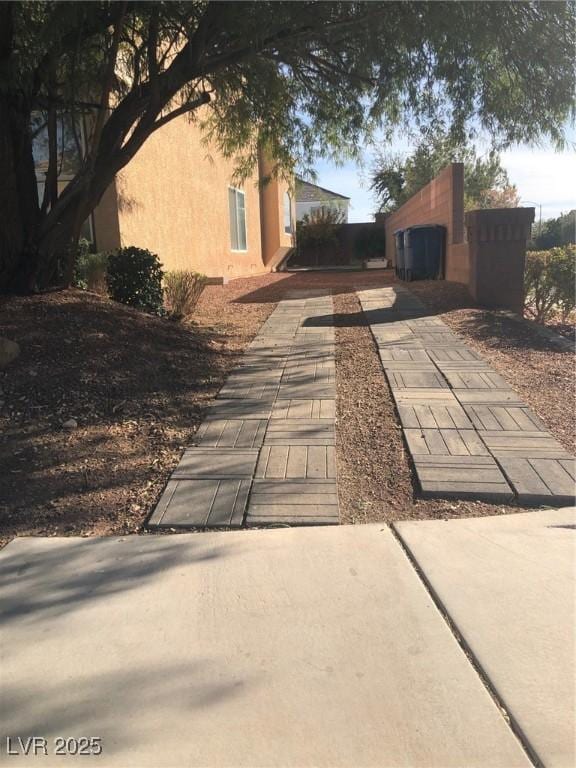 view of side of home featuring stucco siding