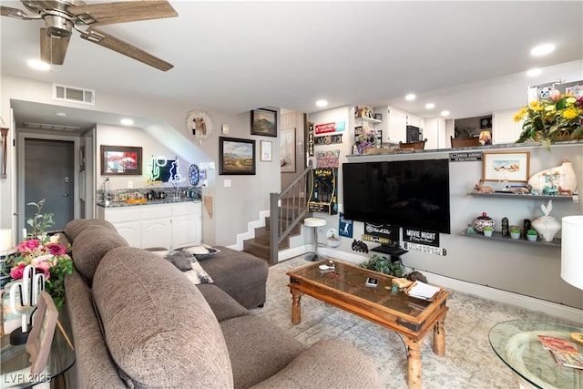 living area with recessed lighting, visible vents, stairway, ceiling fan, and baseboards