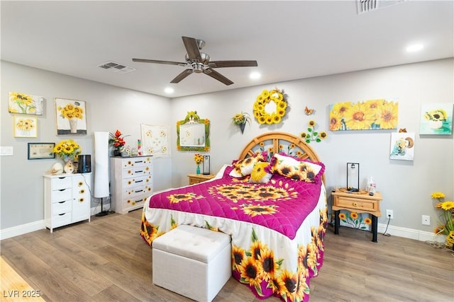 bedroom featuring baseboards, visible vents, wood finished floors, and recessed lighting