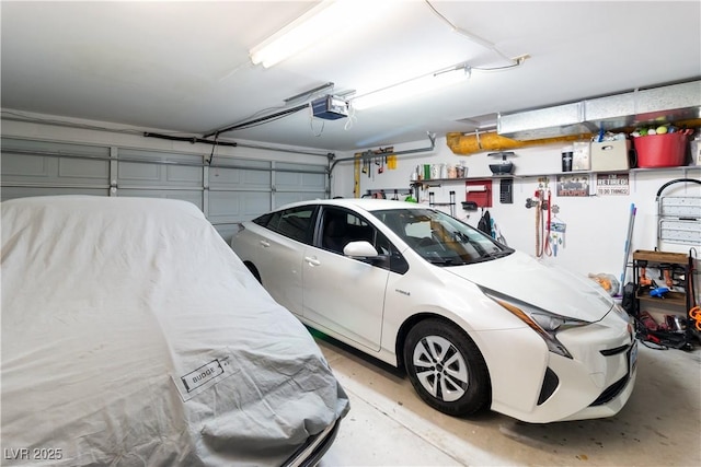 garage featuring a garage door opener