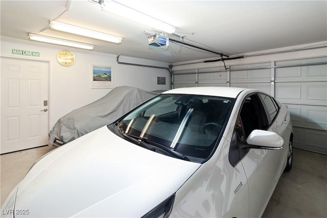 garage featuring a garage door opener