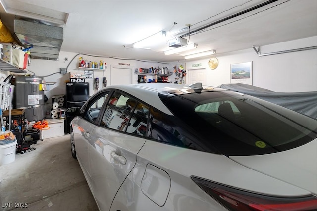 garage featuring secured water heater and a garage door opener