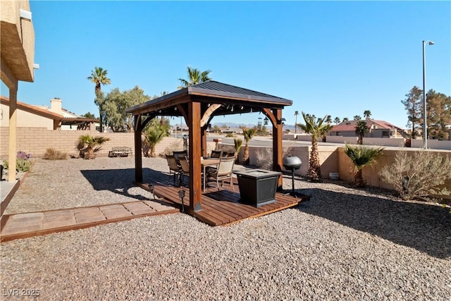 view of yard featuring a fenced backyard, a patio, and a gazebo