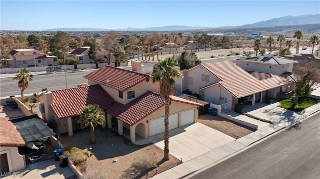 drone / aerial view with a mountain view and a residential view