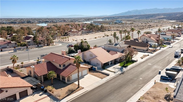 drone / aerial view featuring a mountain view and a residential view