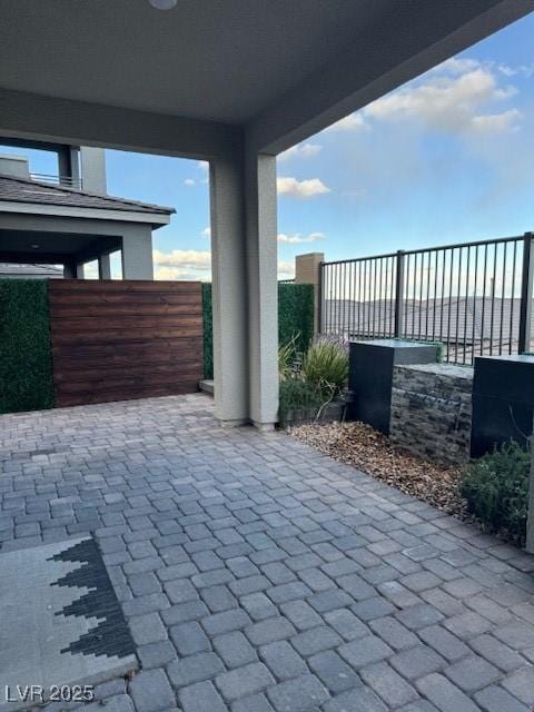 view of patio / terrace featuring fence