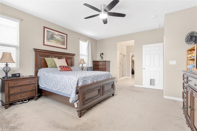 bedroom with light carpet, ceiling fan, and baseboards