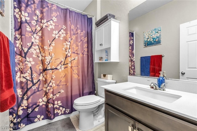 bathroom with tile patterned flooring, vanity, toilet, and a shower with curtain