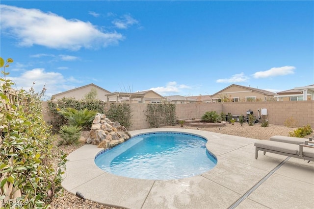 view of swimming pool with a patio area, a fenced backyard, and a fenced in pool