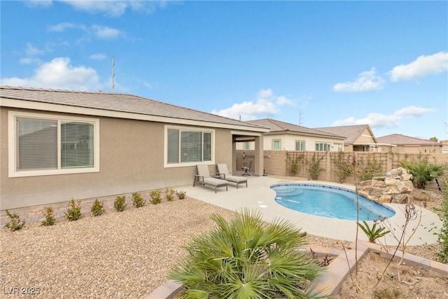 view of pool featuring a patio area, a fenced backyard, and a fenced in pool