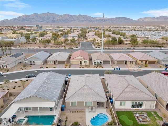 aerial view featuring a mountain view and a residential view