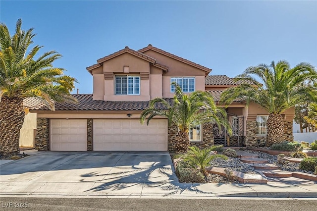 mediterranean / spanish-style house featuring stone siding, a tile roof, driveway, and stucco siding