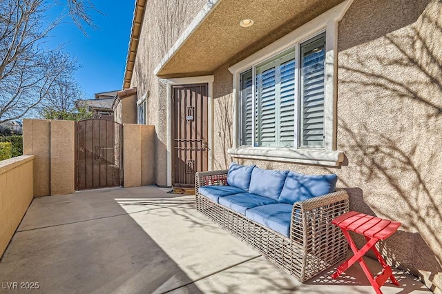 view of patio featuring a gate and outdoor lounge area