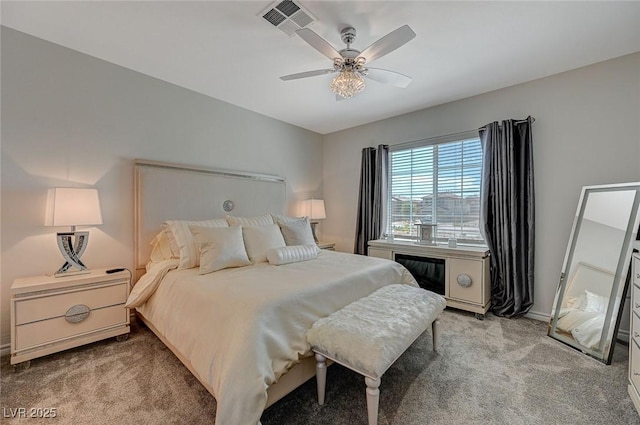 bedroom featuring light carpet, ceiling fan, and visible vents