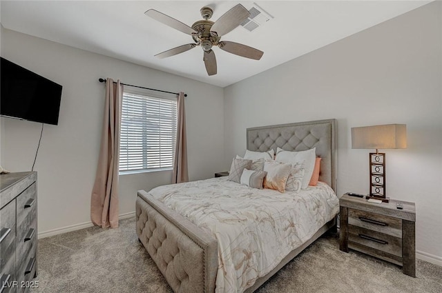 bedroom with ceiling fan, visible vents, baseboards, and light colored carpet