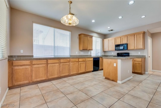 kitchen featuring black appliances, a kitchen island, visible vents, and recessed lighting