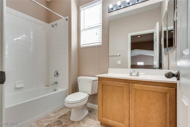 bathroom featuring shower / washtub combination, vanity, and toilet