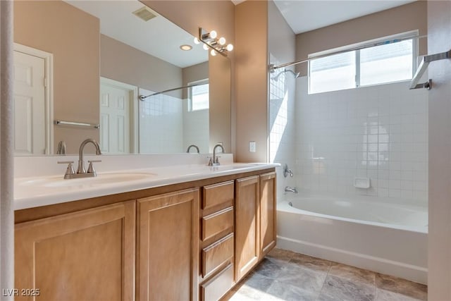 full bathroom featuring shower / bathtub combination, double vanity, a sink, and visible vents