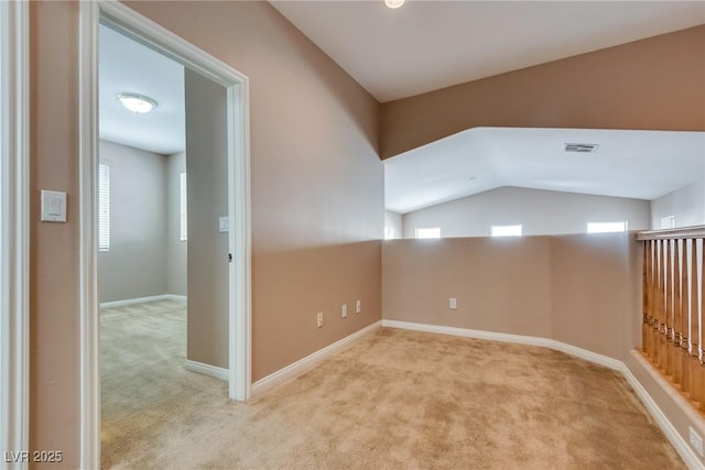 bonus room with lofted ceiling, carpet flooring, visible vents, and baseboards