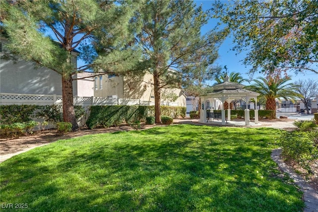 view of yard with fence and a gazebo