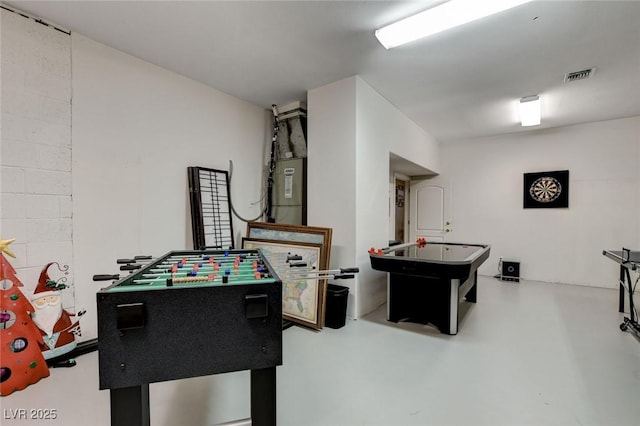 playroom featuring concrete floors and visible vents