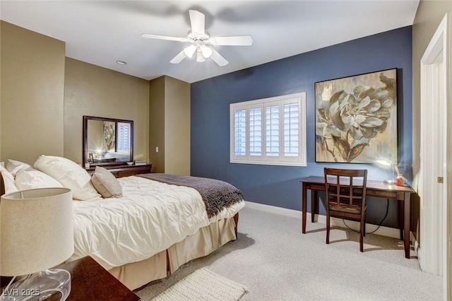 bedroom featuring a ceiling fan, carpet, and baseboards