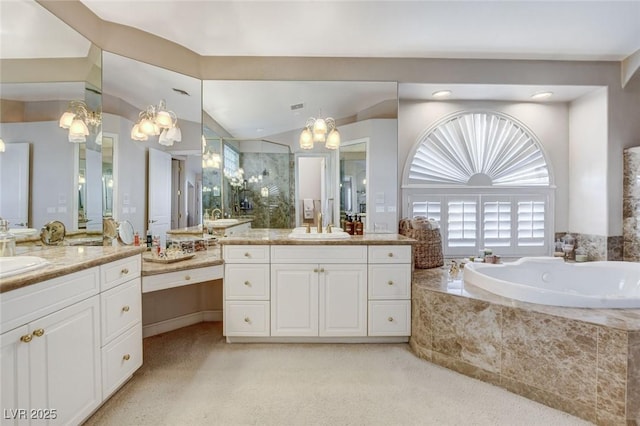 bathroom with lofted ceiling, a stall shower, a sink, and a garden tub