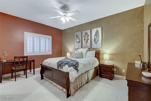 bedroom featuring light carpet, ceiling fan, and baseboards