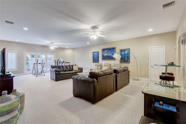 living area featuring carpet, visible vents, ceiling fan, and recessed lighting