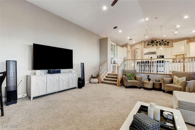 living area with light carpet, baseboards, stairway, vaulted ceiling, and recessed lighting