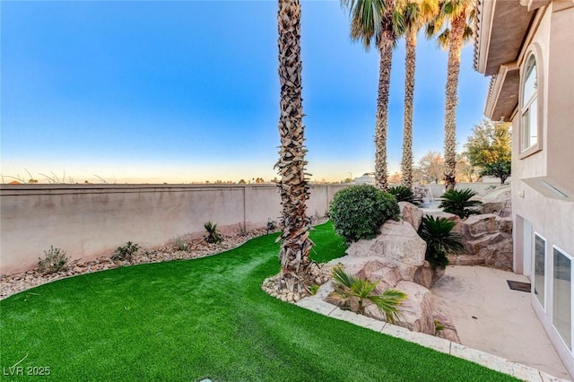 view of yard featuring a fenced backyard