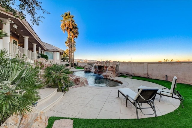 view of pool featuring a patio area, fence, and a fenced in pool